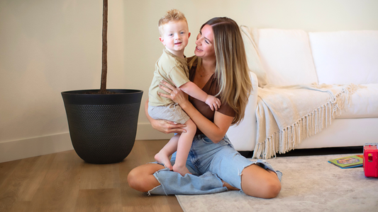 Mom and son sitting on Hewn's Stoneform® flooring.