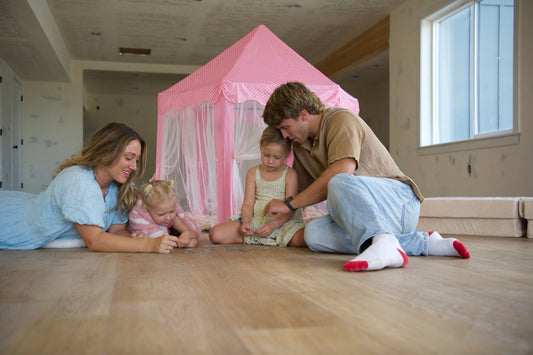 Family playing together on a Hewn Stoneform Floor in the color Golden from the Becki Owens Elite Stoneform Collection