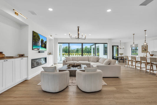 Open concept modern home featuring Honey by Becki Owens for durable flooring that's waterproof, scratch resistant, stain resistant, and built for real life. Stoneform is different from LVP and tile and hardwood. It's 70% limestone