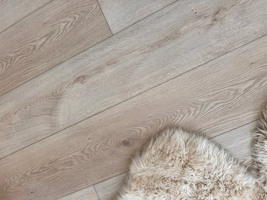 Stoneform in the color Rustic from the Becki Owens Collection in a top down view featuring the Stoneform and a plush white rug