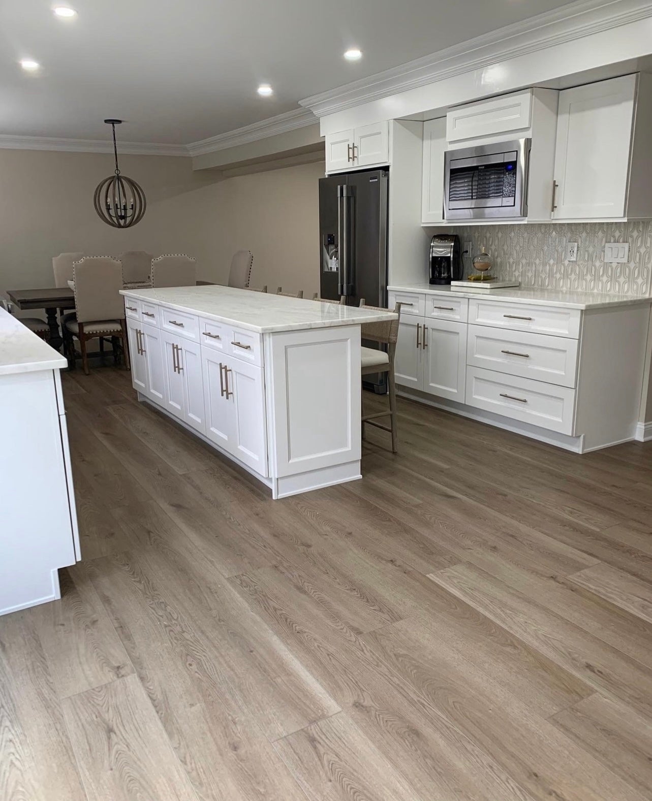 Photo of Bare Becki Owens Elite Stoneform Plank Flooring in a kitchen