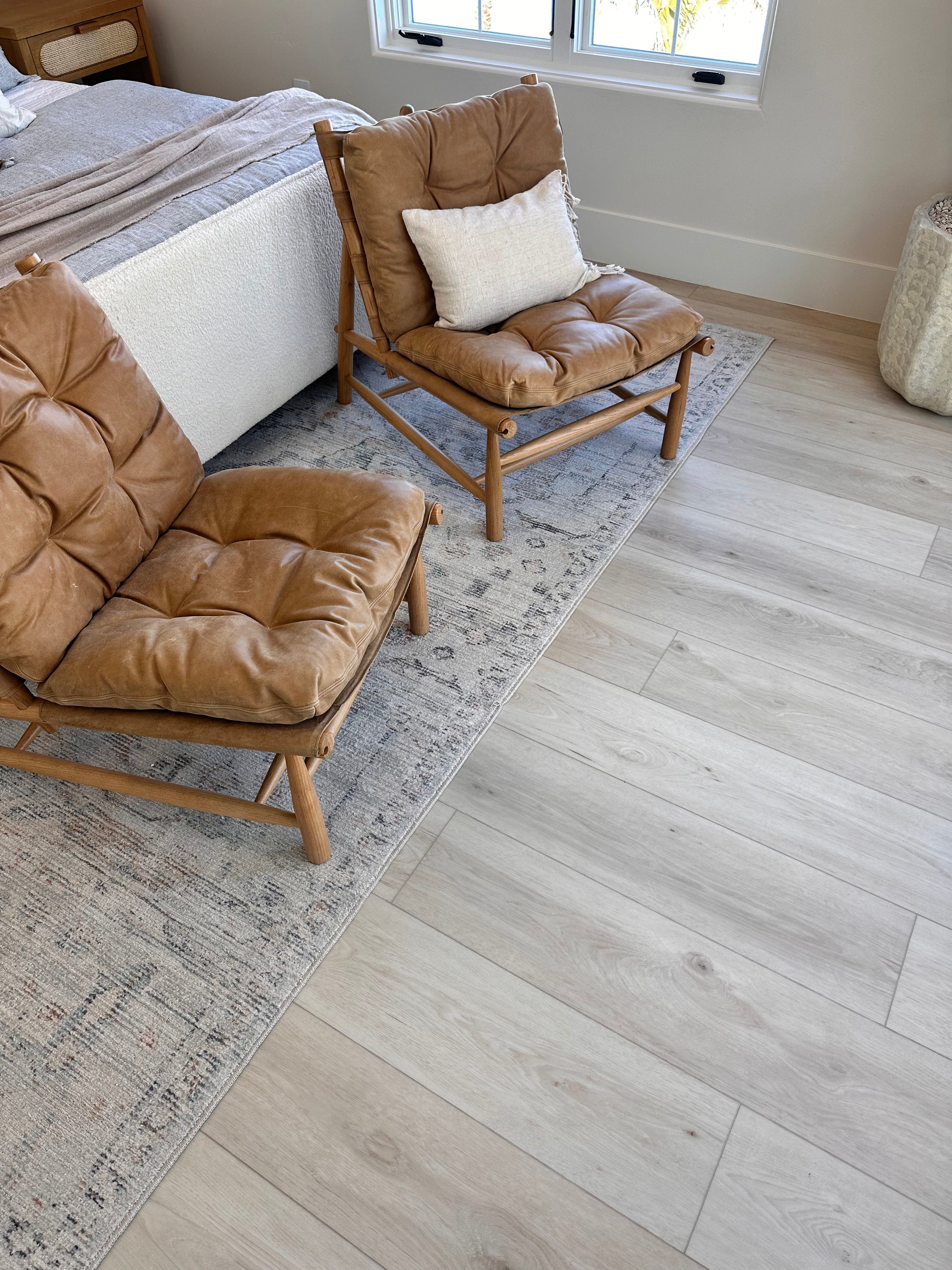 Photo of Riviera Becki Owens Elite Stoneform Plank Flooring in a bedroom