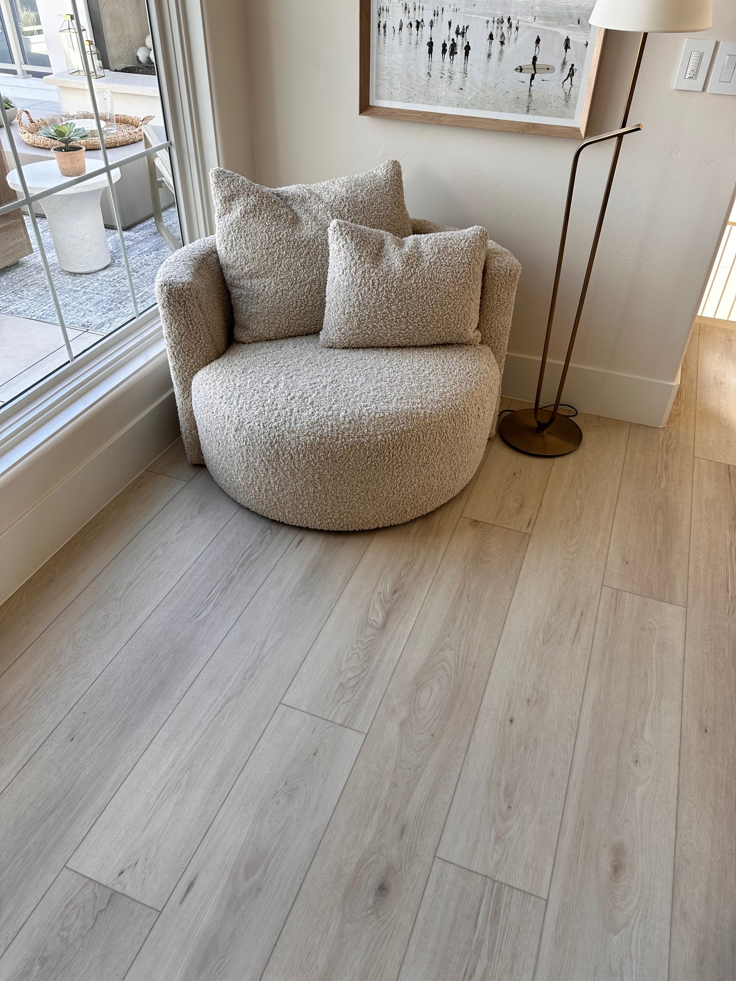 Photo of Riviera Becki Owens Elite Stoneform Plank Flooring in a sitting area