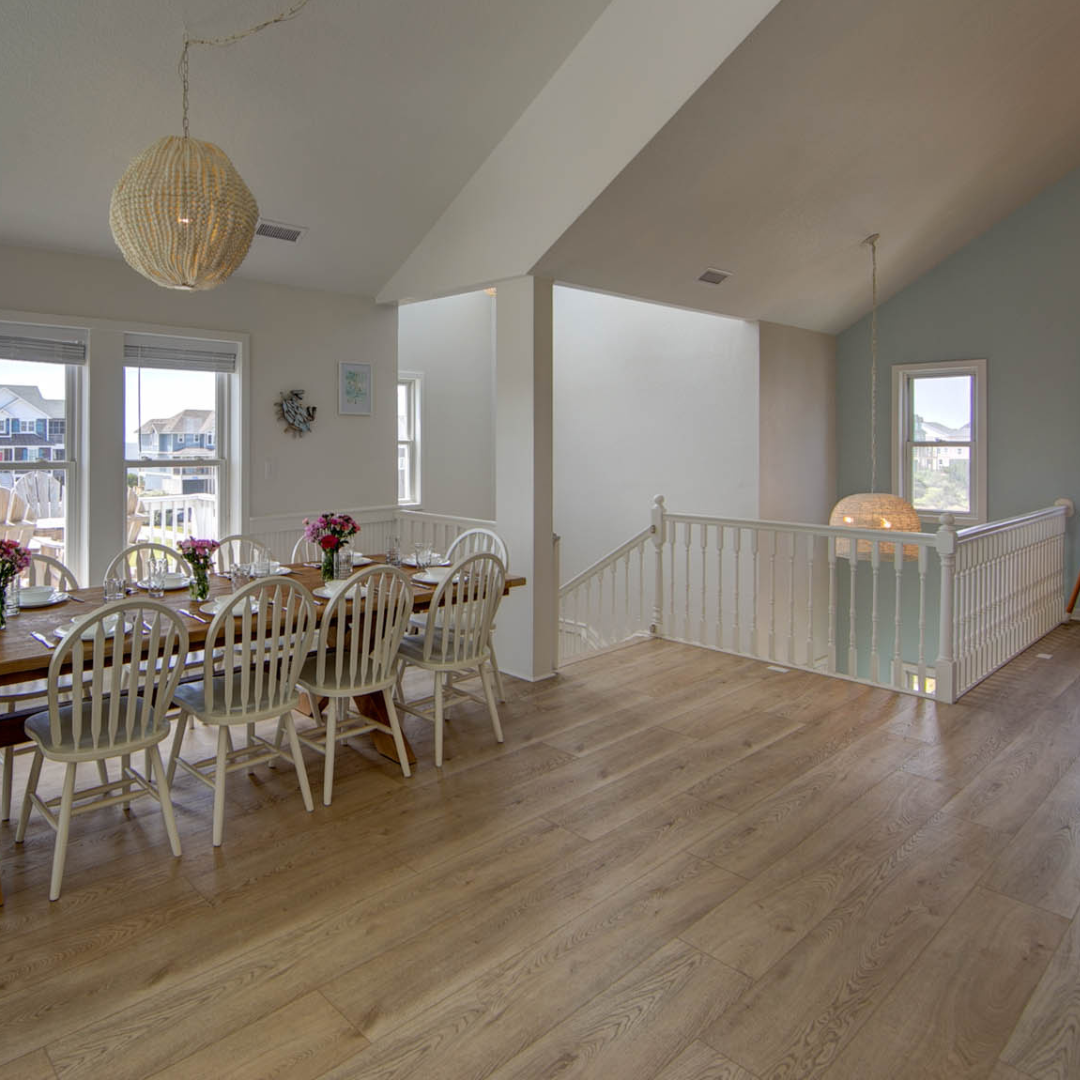 Hewn's Elk Stoneform® from the Angela Rose Collection in the dining area of a beach home.