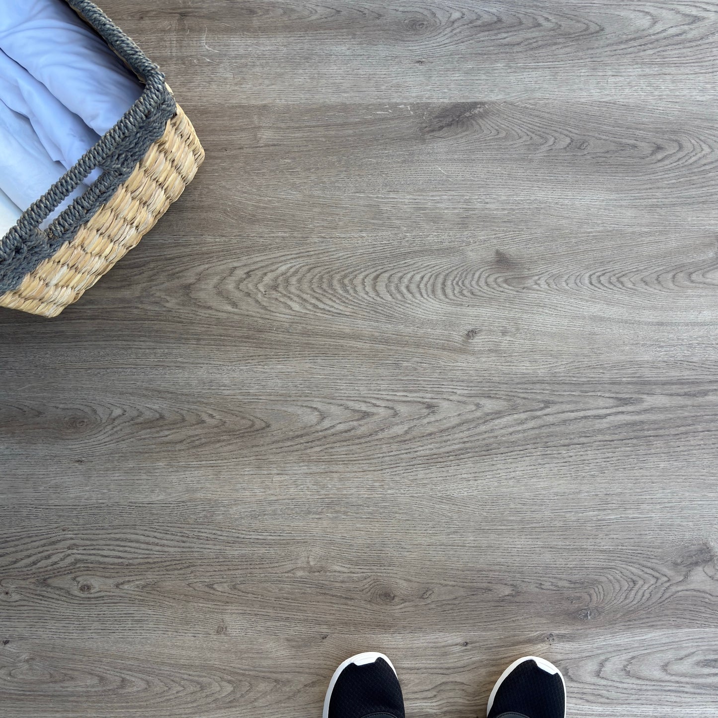 A top-down photo of the flooring color Bare from the Hewn Floor Becki Owens Select Stoneform Luxury Plank Flooring Collection