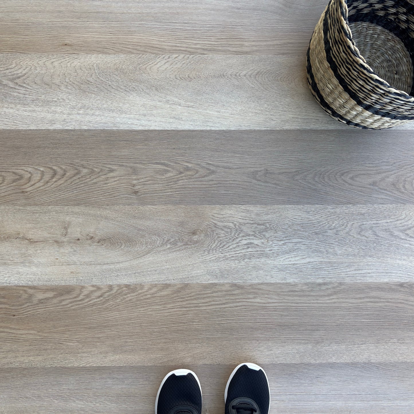 A top-down photo of the flooring color Hender from the Hewn Floor Angela Rose Select Stoneform Luxury Plank Flooring Collection