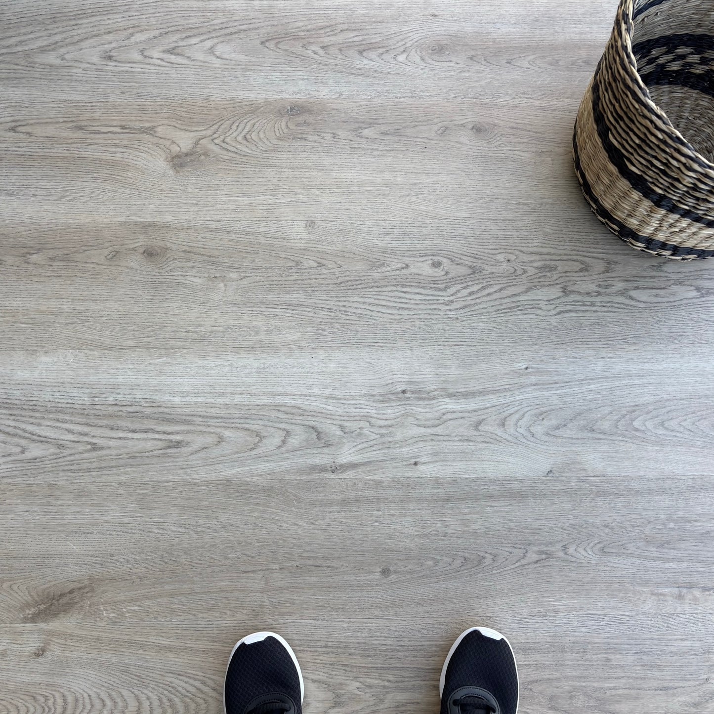A top-down photo of the flooring color Honey from the Hewn Floor Becki Owens Select Stoneform Luxury Plank Flooring Collection