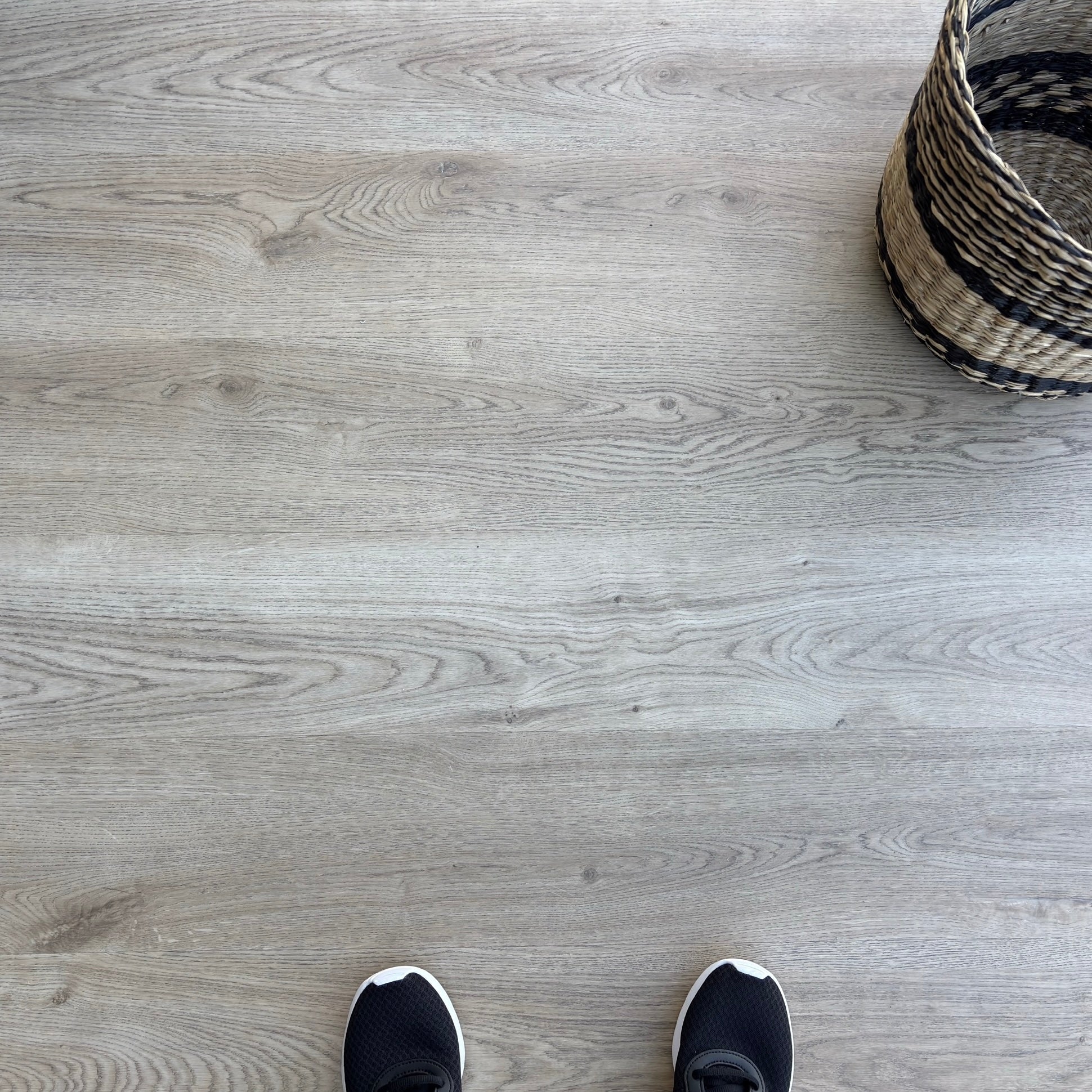 A top-down photo of the flooring color Honey from the Hewn Floor Becki Owens Select Stoneform Luxury Plank Flooring Collection