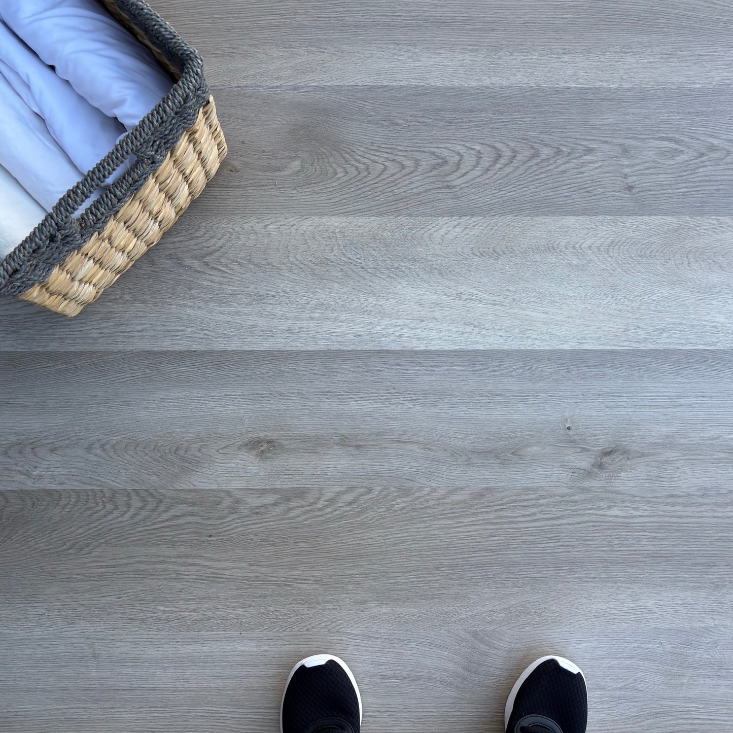 A top-down photo of the flooring color Rustic from the Hewn Floor Becki Owens Select Stoneform Luxury Plank Flooring Collection