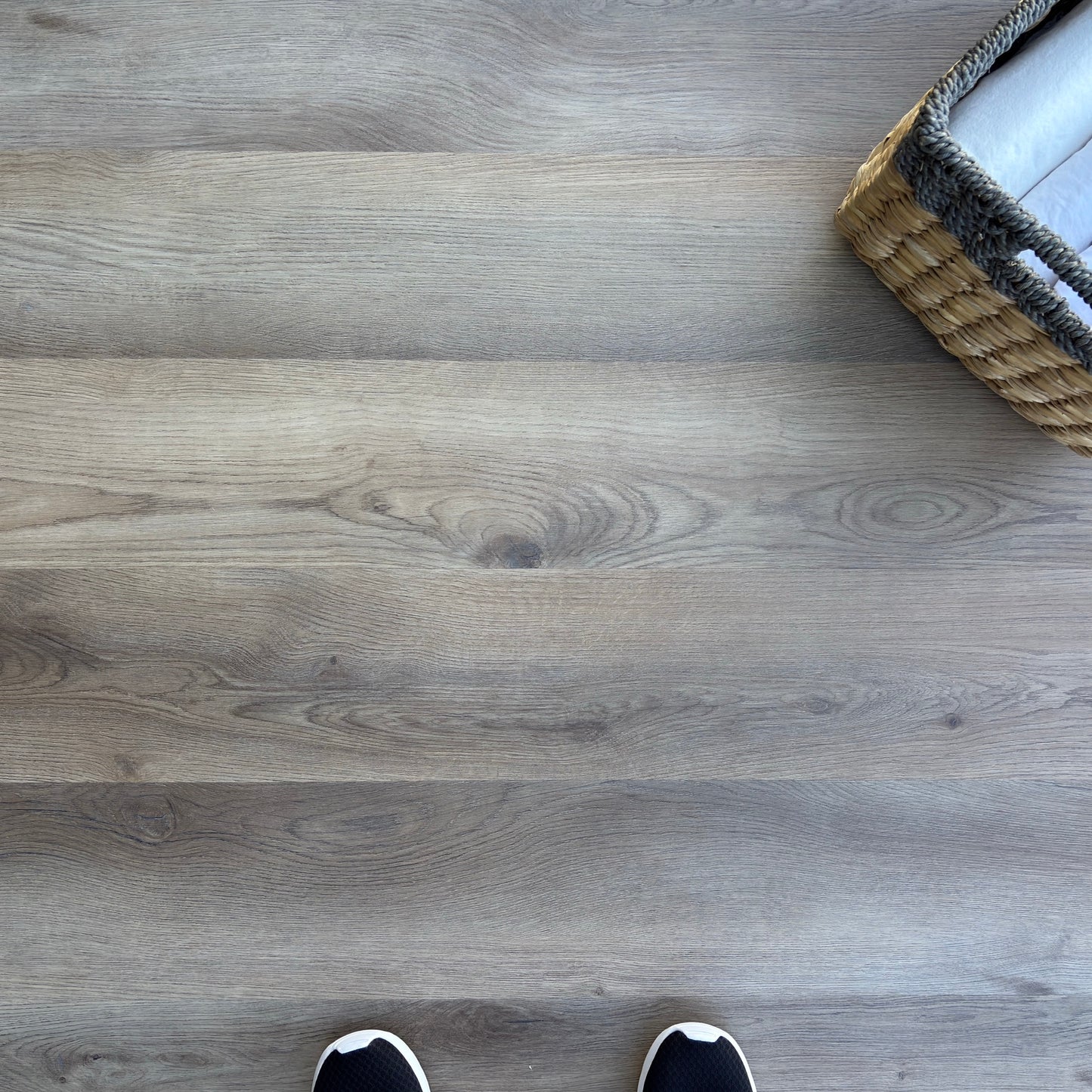 A top-down photo of the flooring color Sutterlin from the Hewn Floor Galey Alix Select Stoneform Luxury Plank Flooring Collection