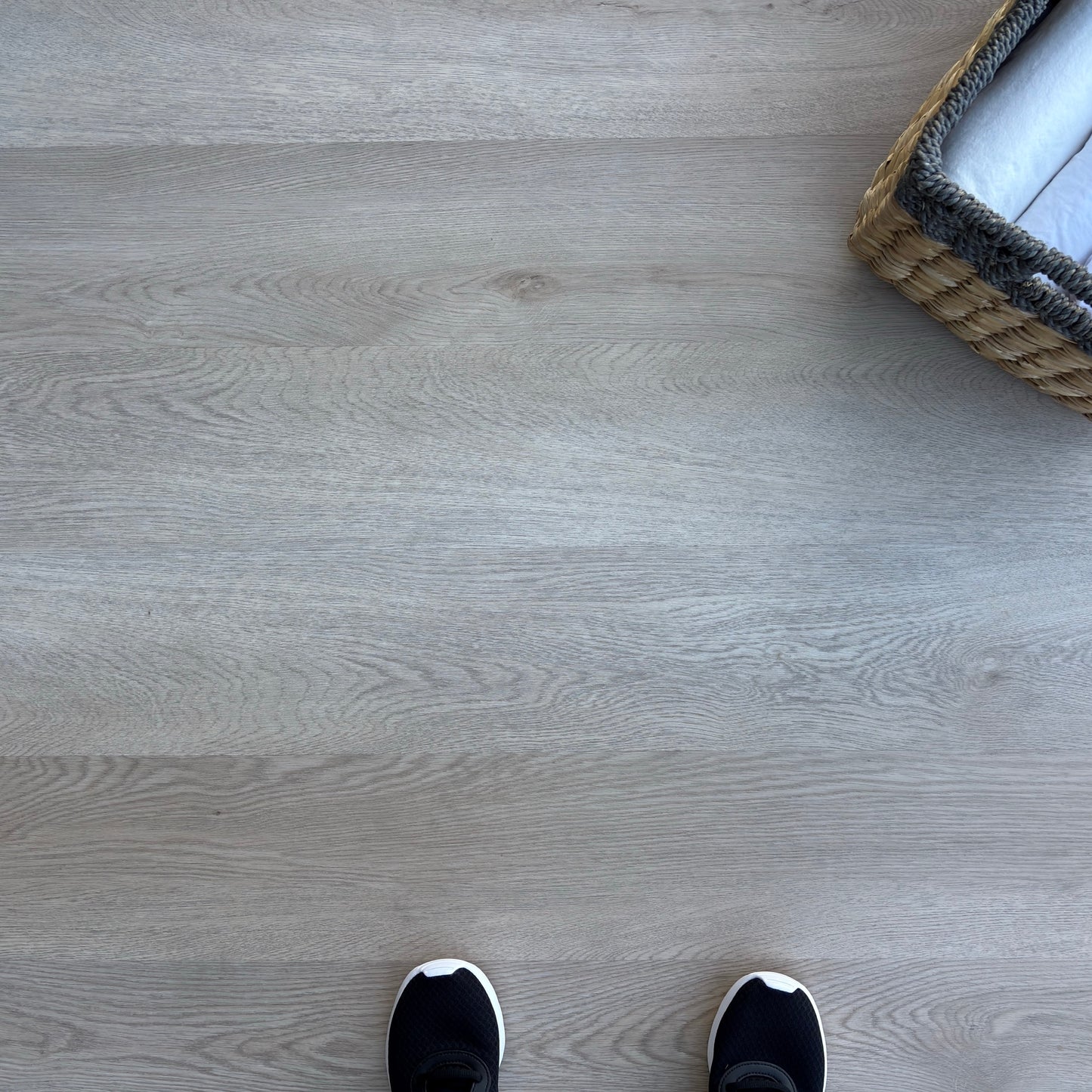A top-down photo of the flooring color Weathered from the Hewn Floor Becki Owens Select Stoneform Luxury Plank Flooring Collection