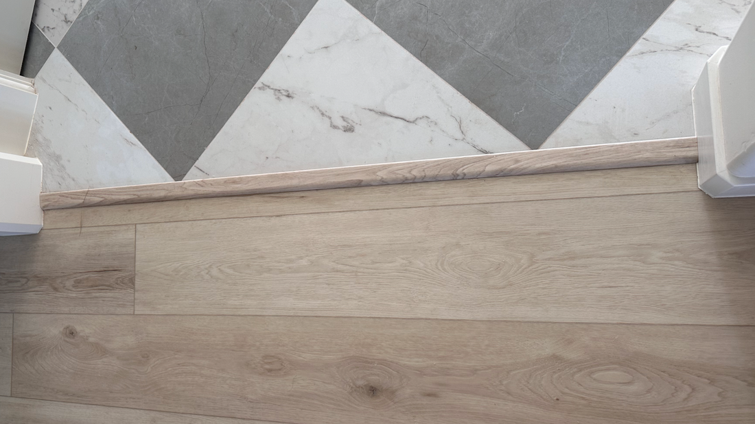 Reducer transition piece installed against Stoneform® and tile. 