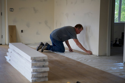 A man installing Stoneform in a new open concept home
