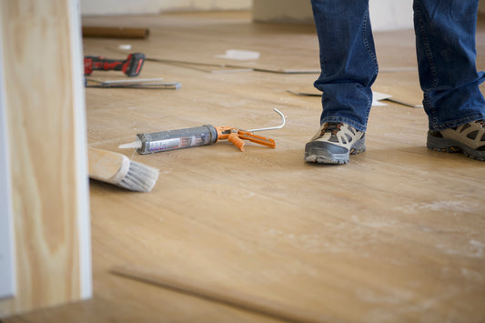 Installing Stoneform by Hewn Floor, close up shot of tools and installer