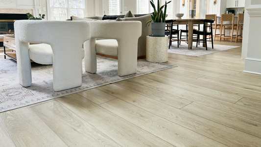 Hewn's Elite Stoneform® flooring installed in a living room and kitchen.