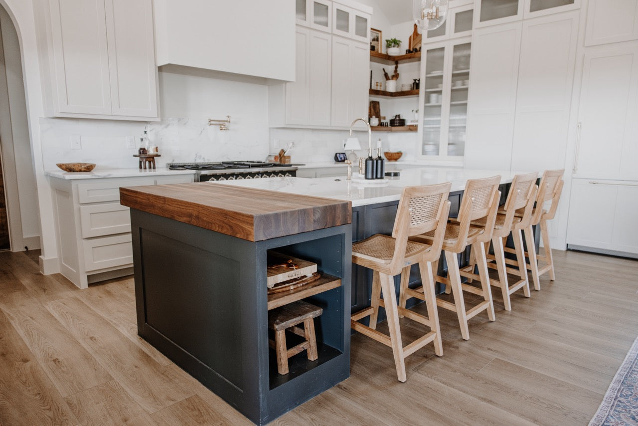 Photo of Bare Becki Owens Elite Stoneform Flooring in a kitchen with a butcher block and island