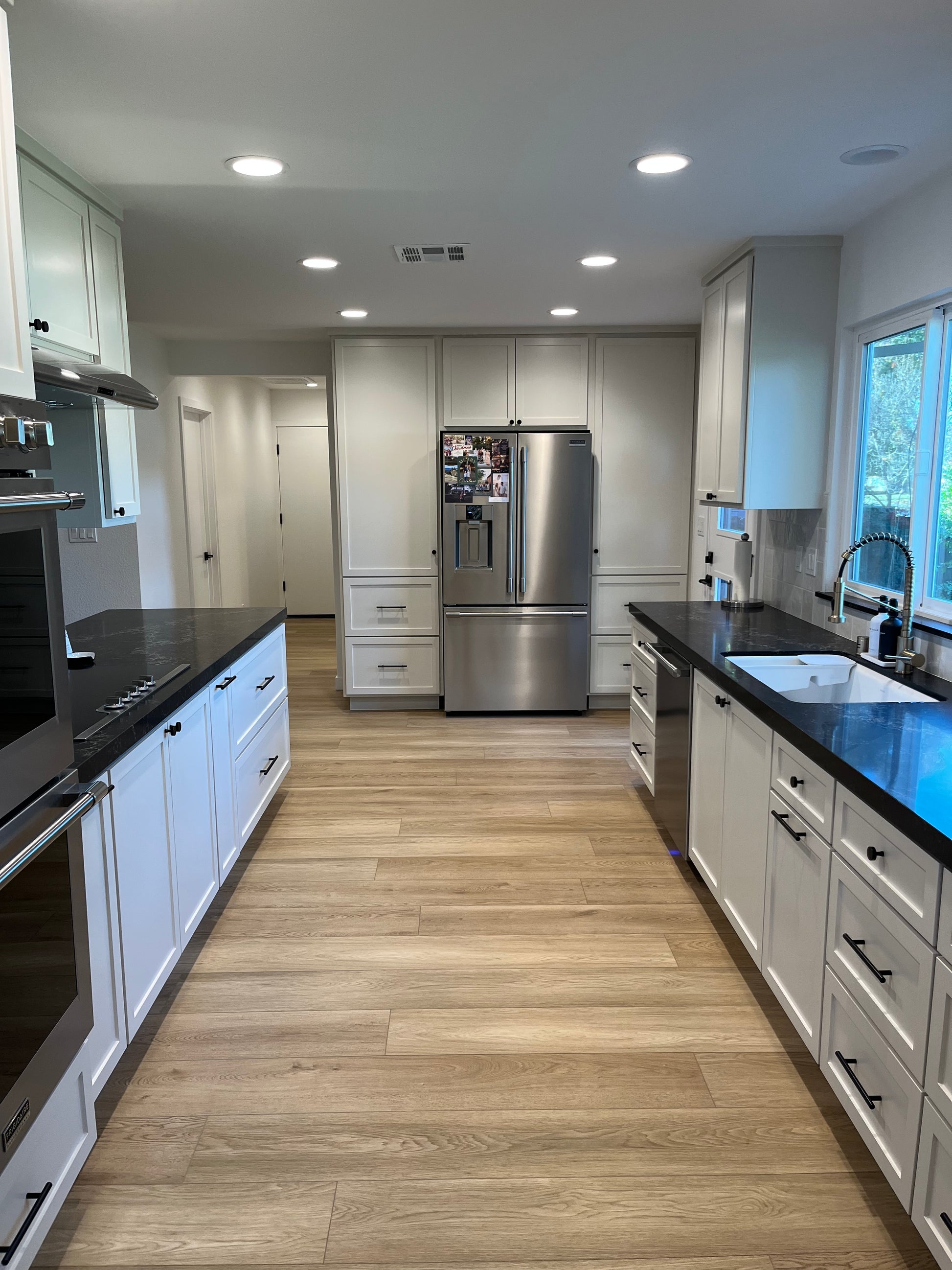 Photo of Honey Becki Owens Elite Stoneform Flooring in an galley kitchen