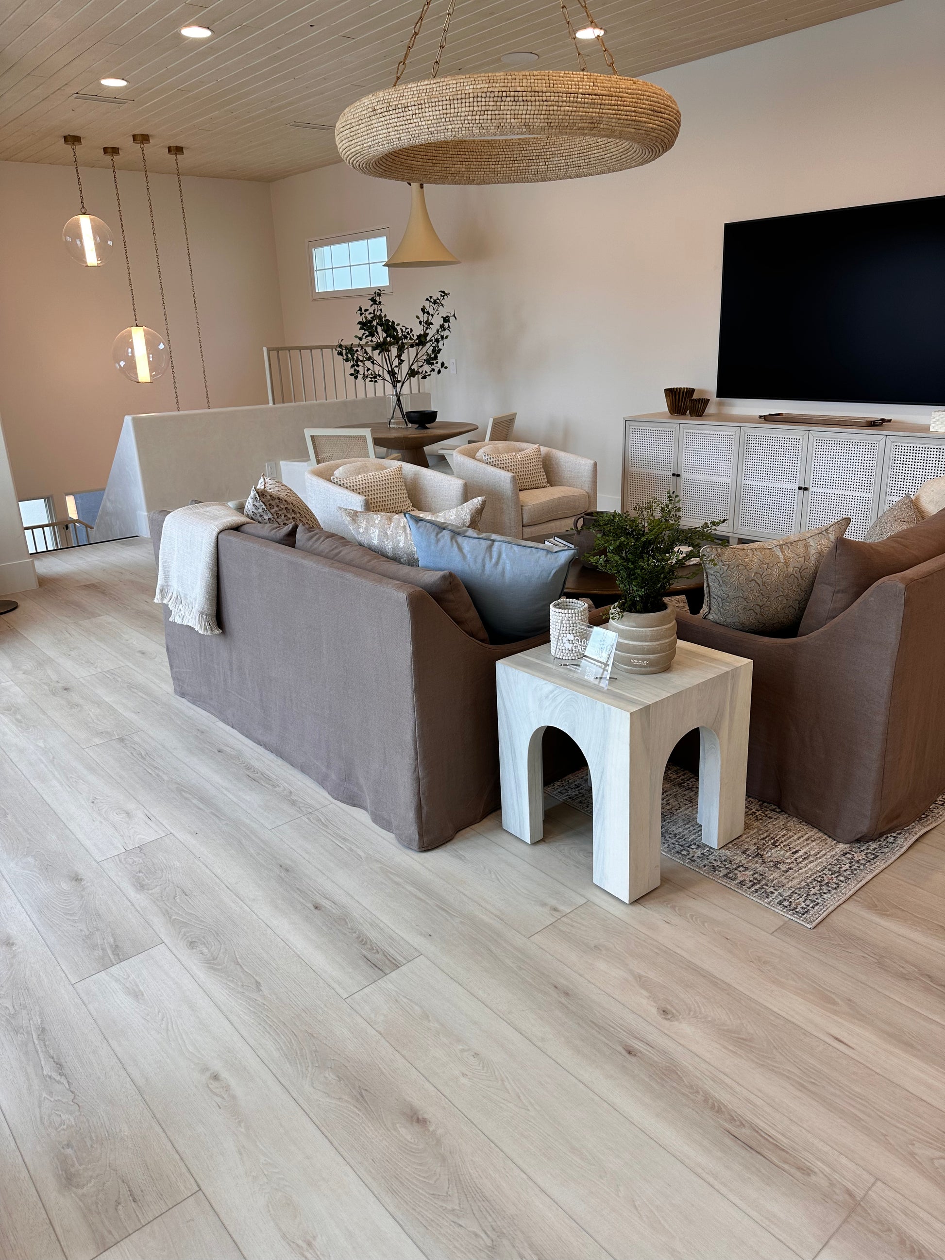 Photo of Riviera Becki Owens Elite Stoneform Plank Flooring in a living room