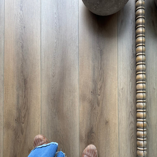 A Photo of Hewn Floor Color Sutterlin in the Galey Alix Elite Stoneform Luxury Vinyl Plank Collection