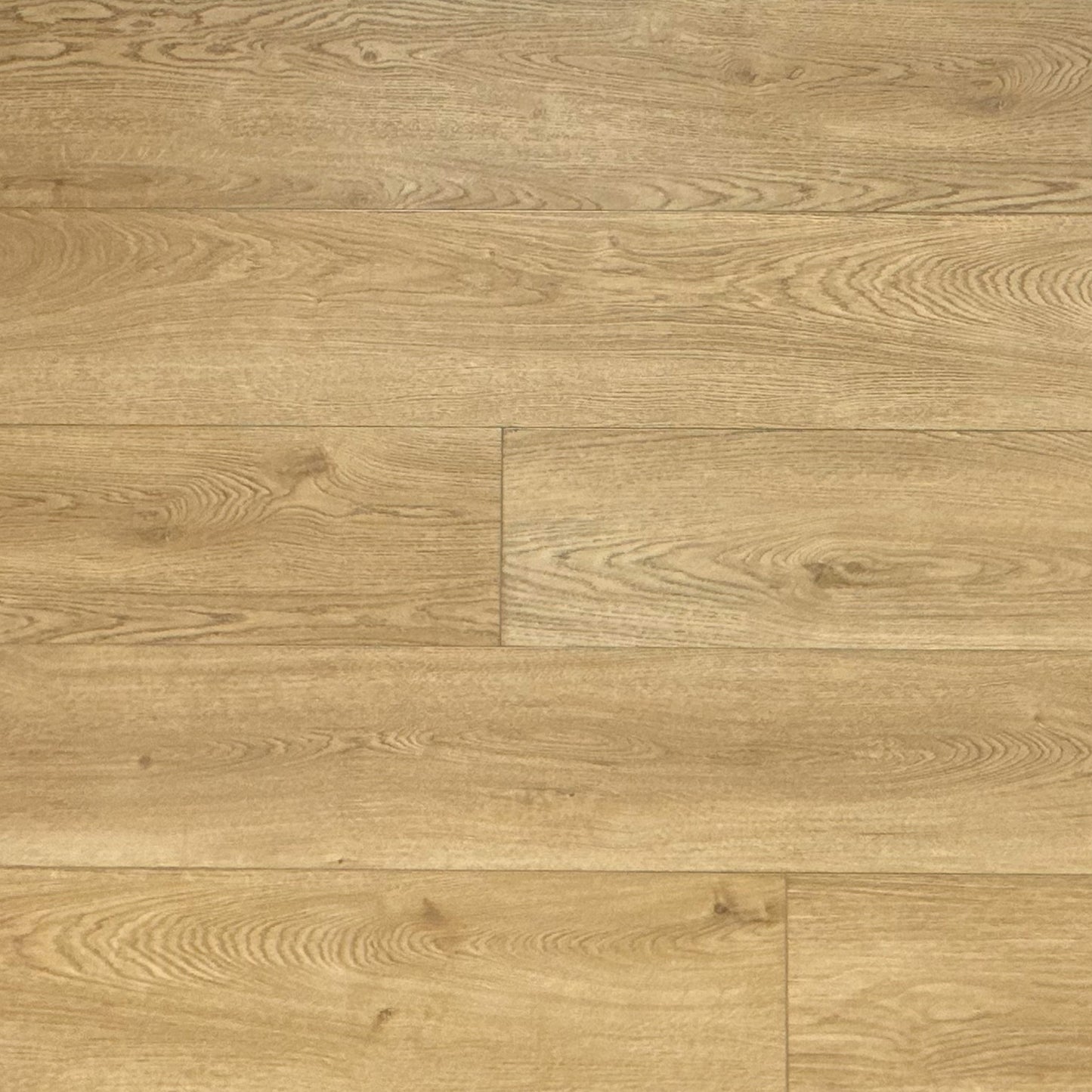 A photo swatch of the flooring color Golden from the Hewn Floor Becki Owens Elite Stoneform Luxury Plank Flooring Collection