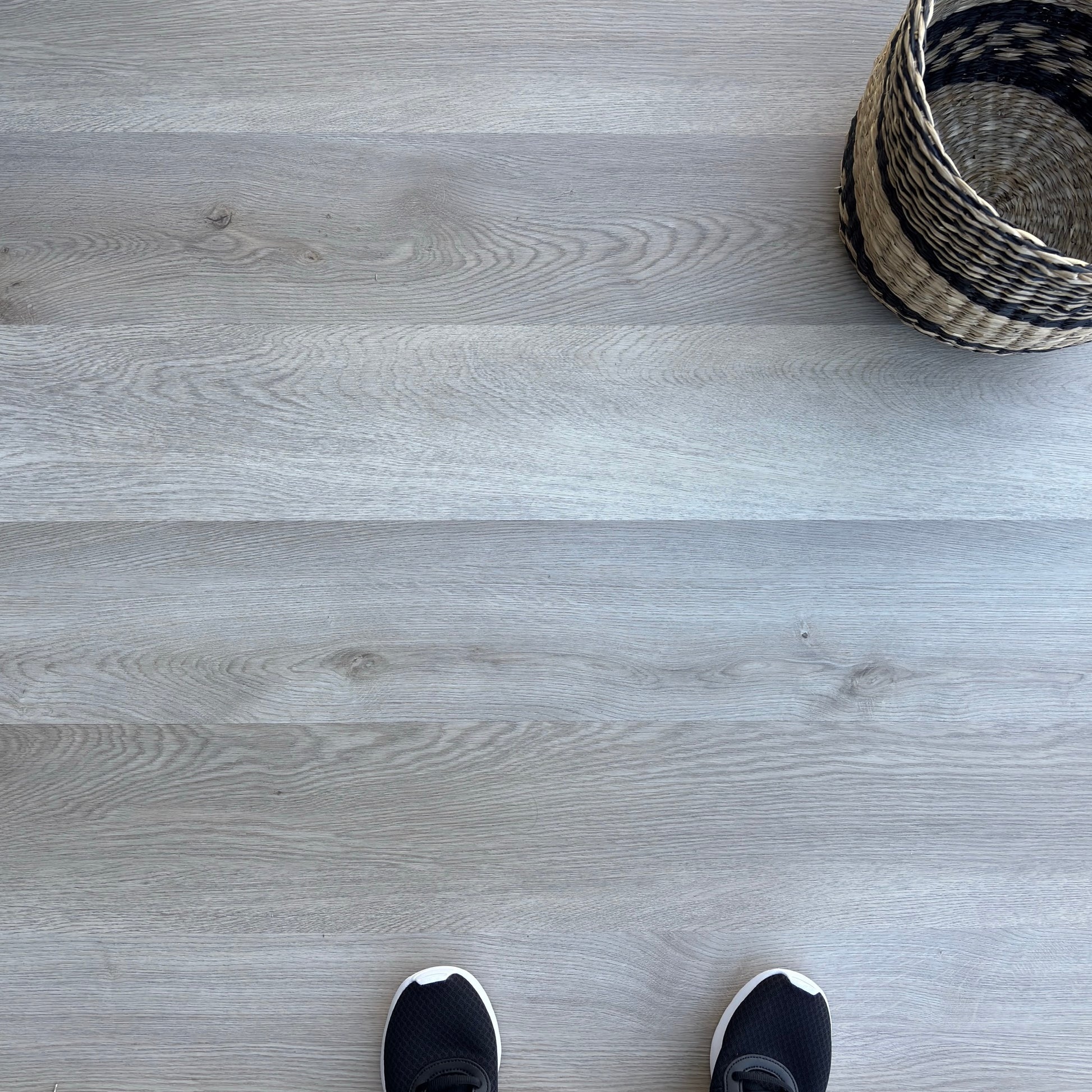 A top-down photo of the flooring color Rustic from the Hewn Floor Becki Owens Select Stoneform Luxury Plank Flooring Collection