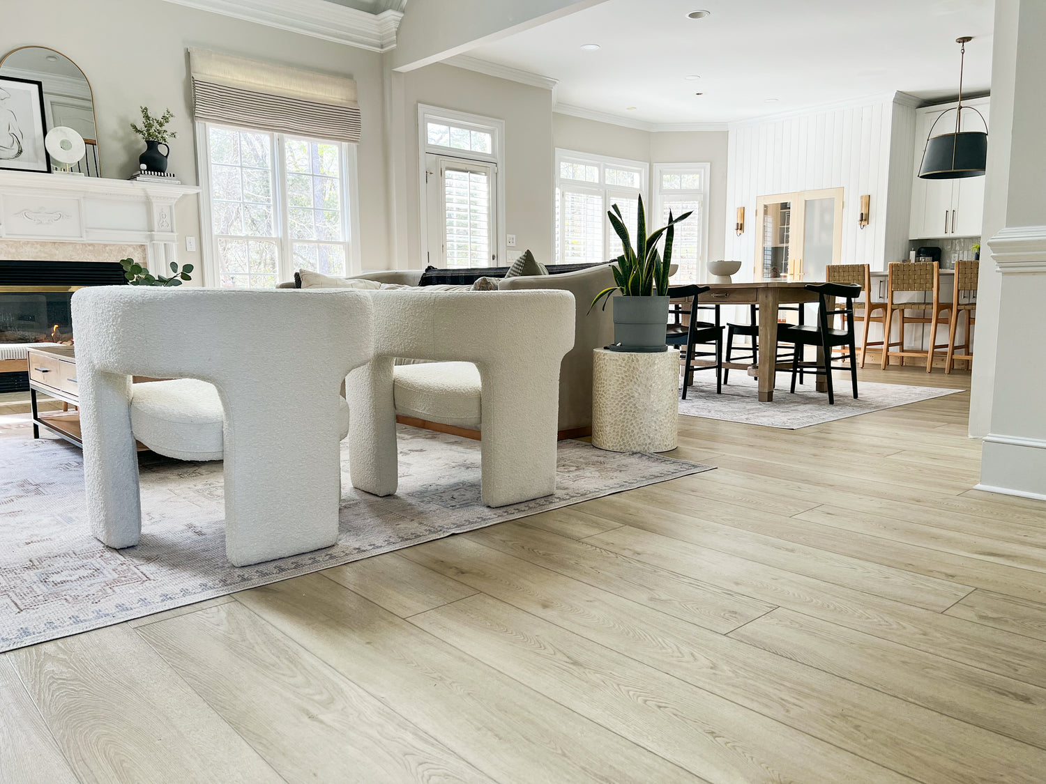 A photo of Hewn Stoneform Elite Luxury Plank Flooring installed in a living room.