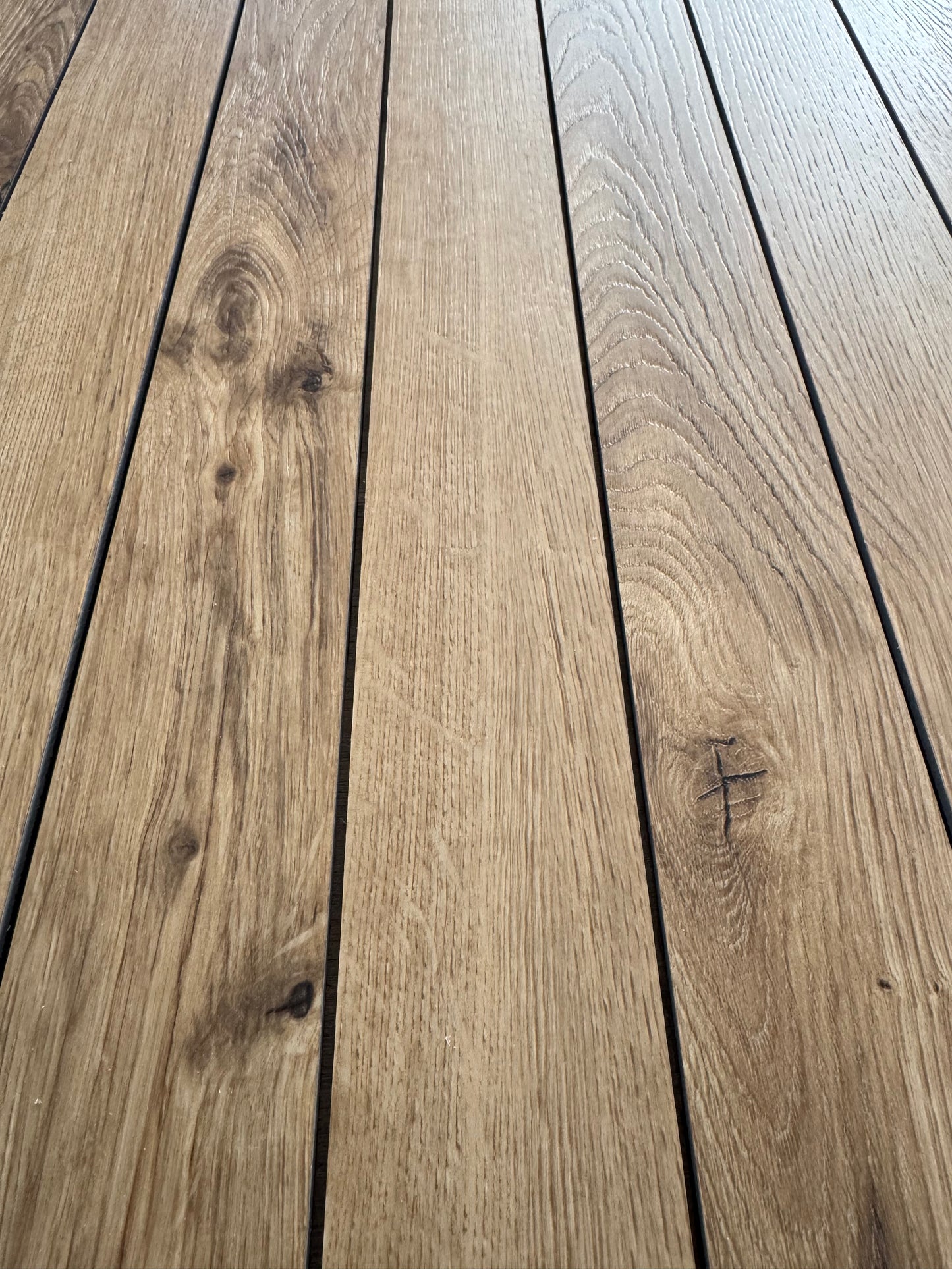 A closeup photo of cut pieces of Hewn's Galey Alix Elite Stoneform for Walls and Ceilings in the color Lane.