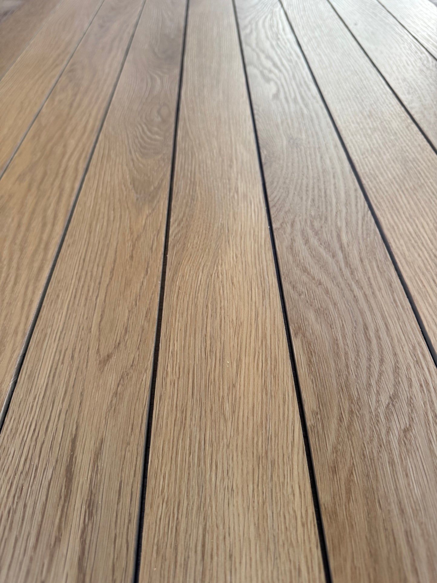 A closeup photo of cut pieces of Hewn's Galey Alix Elite Stoneform for Walls and Ceilings in the color Sanabel.