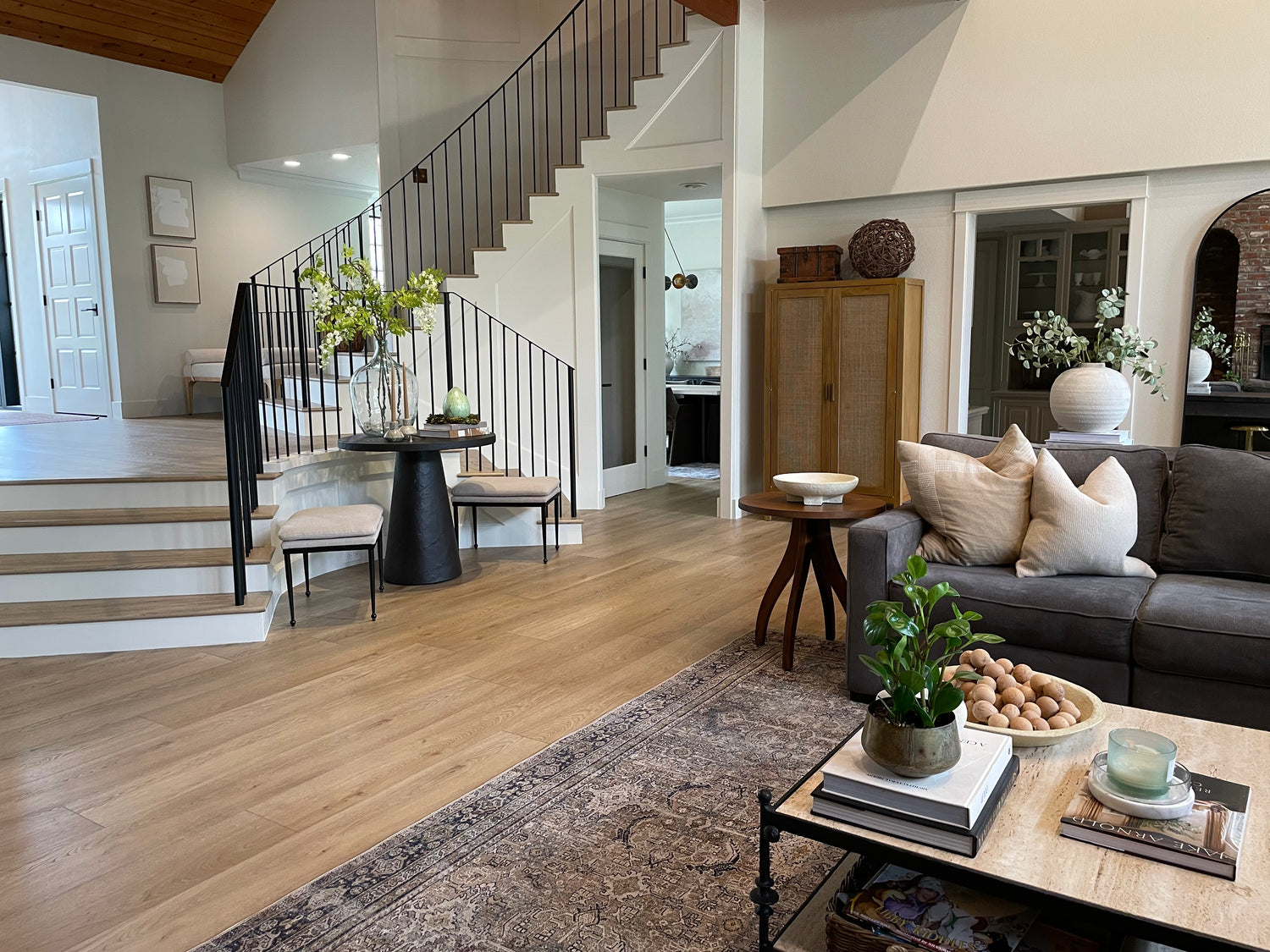 Image of Hewn Stoneform luxury plank flooring on a staircase and in a living room